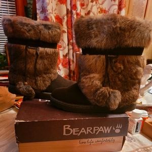 Stylish suede winter fur boots with pom.poms on tied to the side